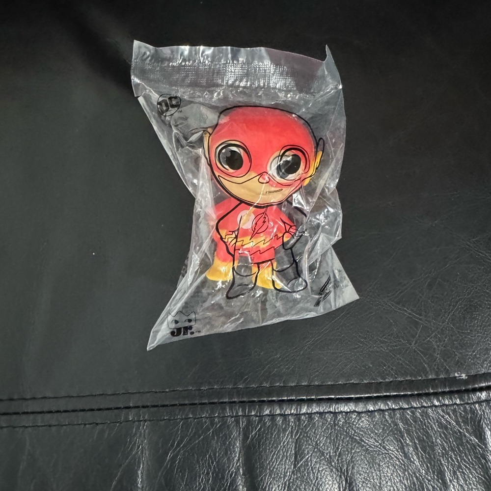 Red and Yellow Superhero Toy Figure